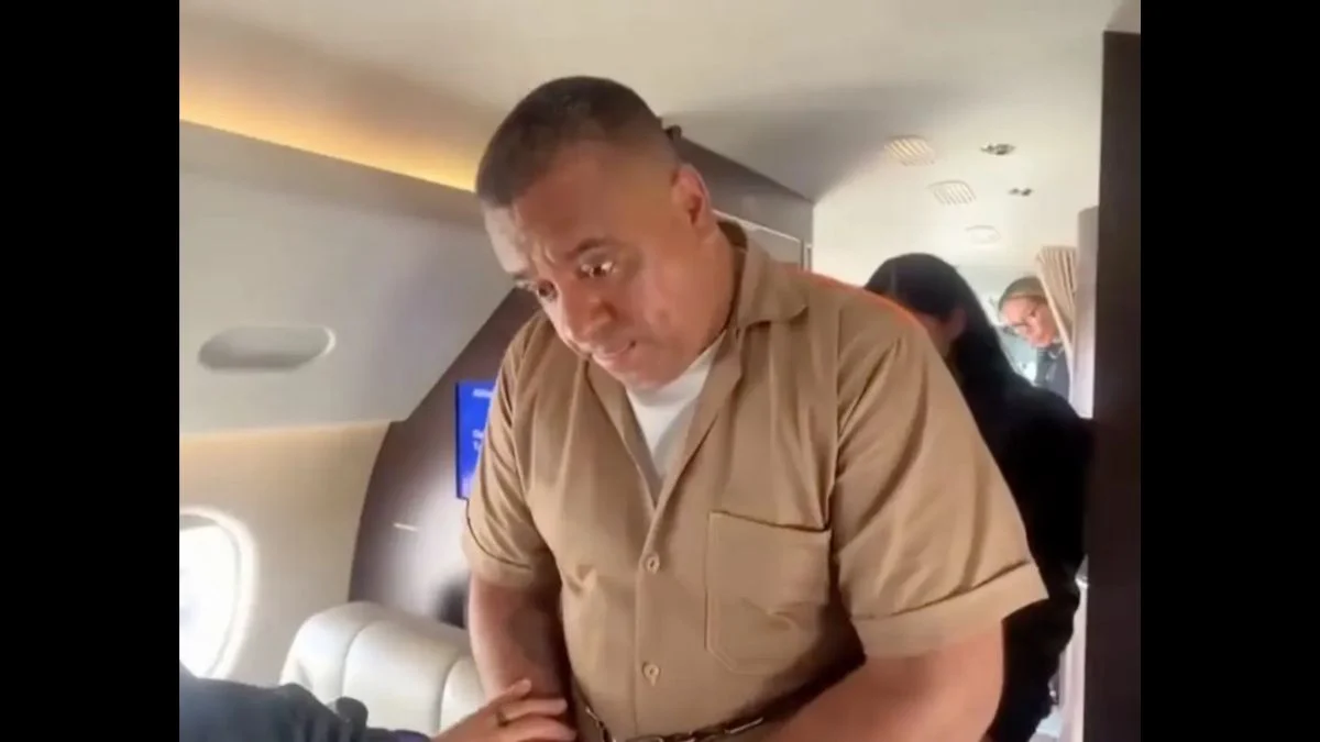 Geovany Andres Rojas known as The Spider being escorted inside an aircraft during his extradition.