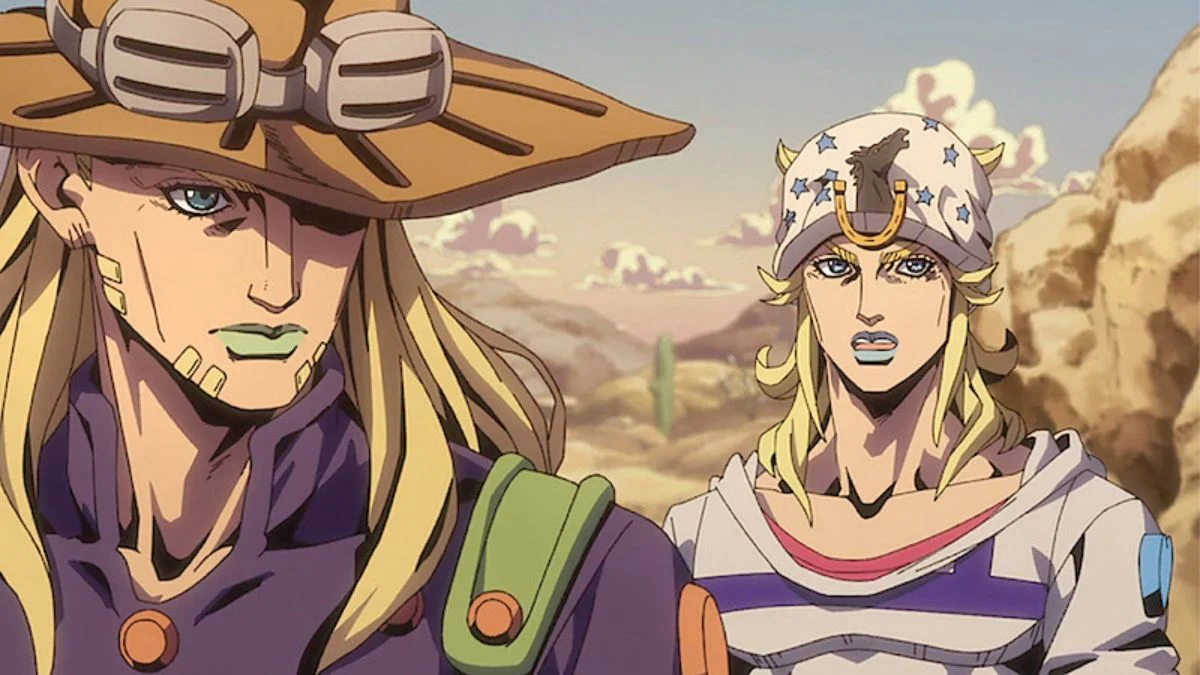 Anime animation still of Gyro Zeppeli with his wide-brimmed hat and green lips standing next to Johnny Joestar wearing his star-patterned horseshoe beanie