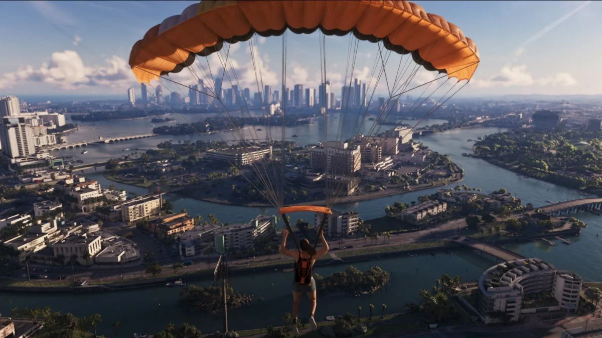 Aerial view of a player parachuting over Vice City's skyline and waterways in Grand Theft Auto VI.