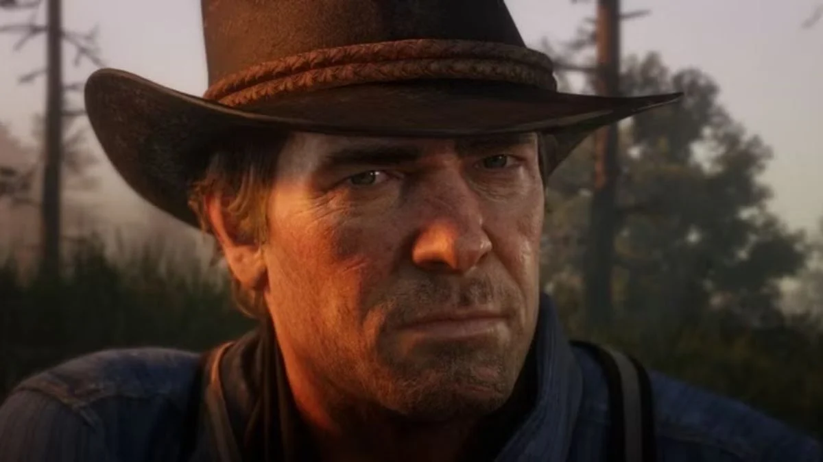 Close-up of Arthur Morgan in Red Dead Redemption 2 wearing a cowboy hat.