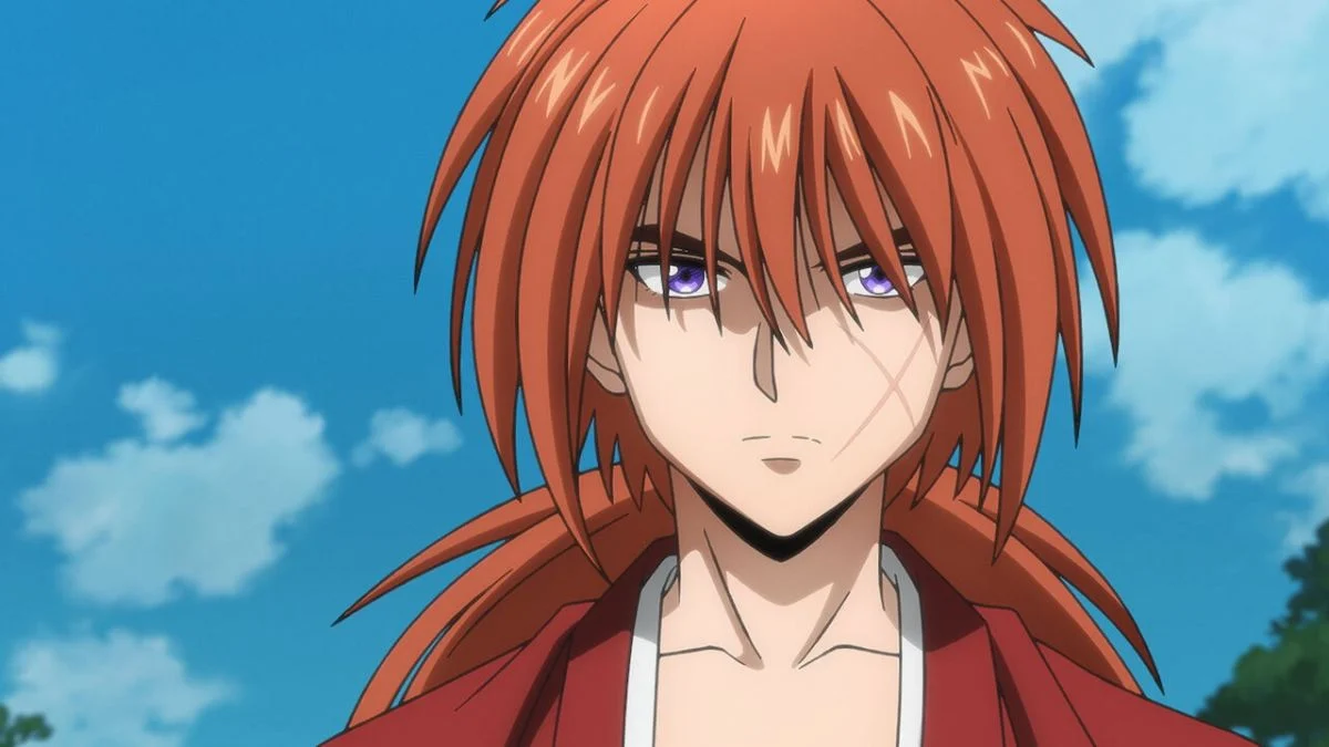 Close-up shot of red-haired protagonist Kenshin Himura with his iconic X-shaped cheek scar in Rurouni Kenshin.