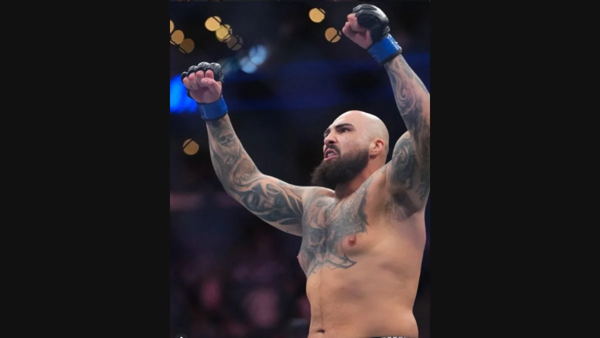 Sean Sharaf celebrating inside the Octagon with arms raised following a 12-second knockout at UFC 331