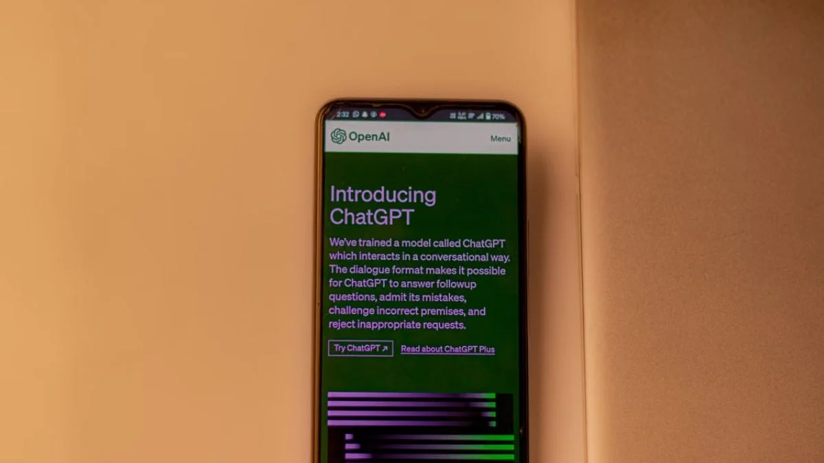 A close-up view of a smartphone displaying the official OpenAI ChatGPT website interface.
