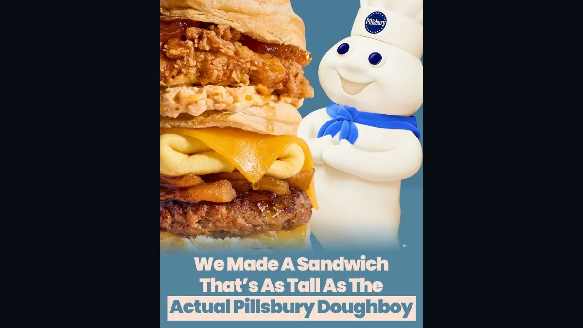Promotional graphic showing the towering Doughboy Deluxe sandwich next to the Pillsbury Doughboy with text reading "We Made A Sandwich That's As Tall As The Actual Pillsbury Doughboy".