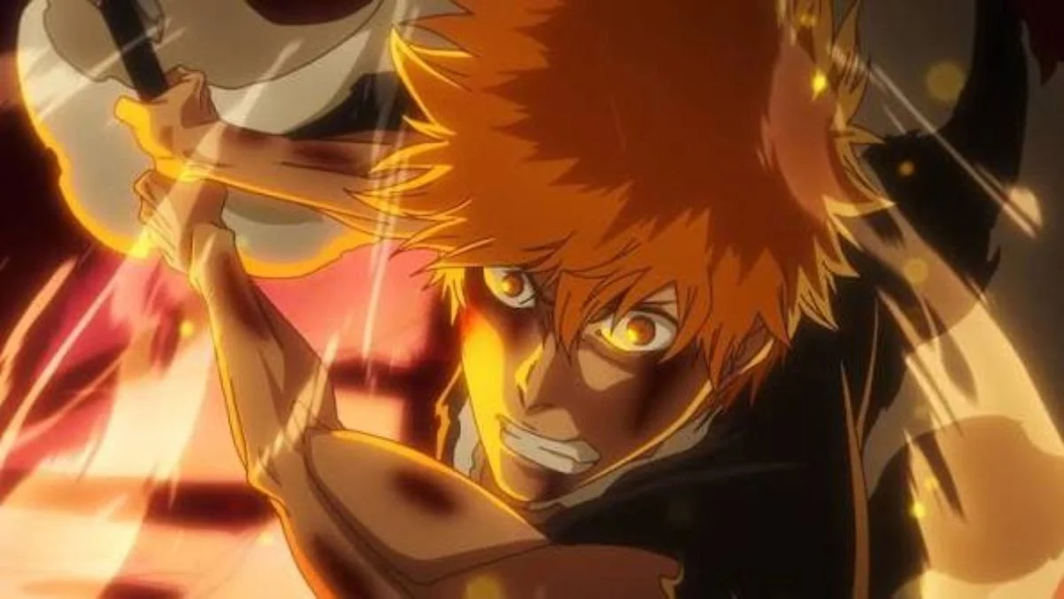 Close-up of Ichigo Kurosaki with glowing yellow eyes holding his Zanpakuto sword during a fierce battle.
