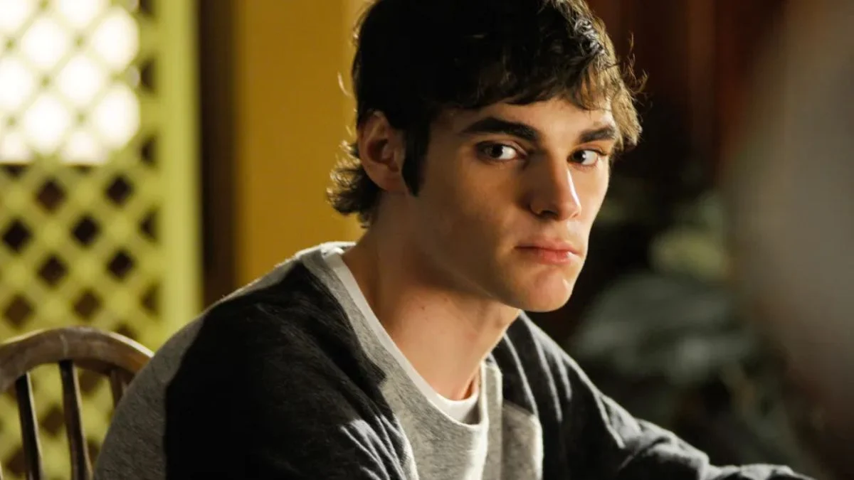 RJ Mitte as Walter White Jr. in a scene from Breaking Bad looking thoughtfully to the side.