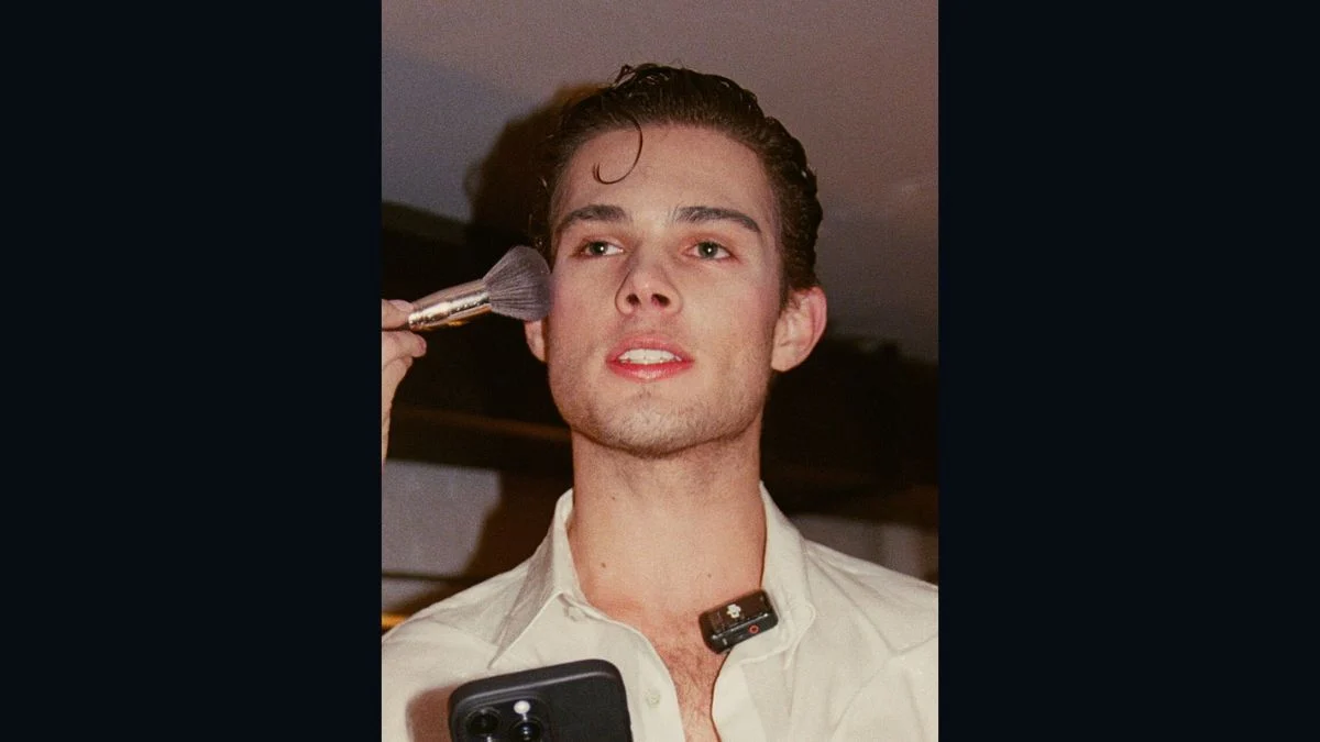 Social media influencer Braden Peters, known as Clavicular, having makeup applied with a powder brush