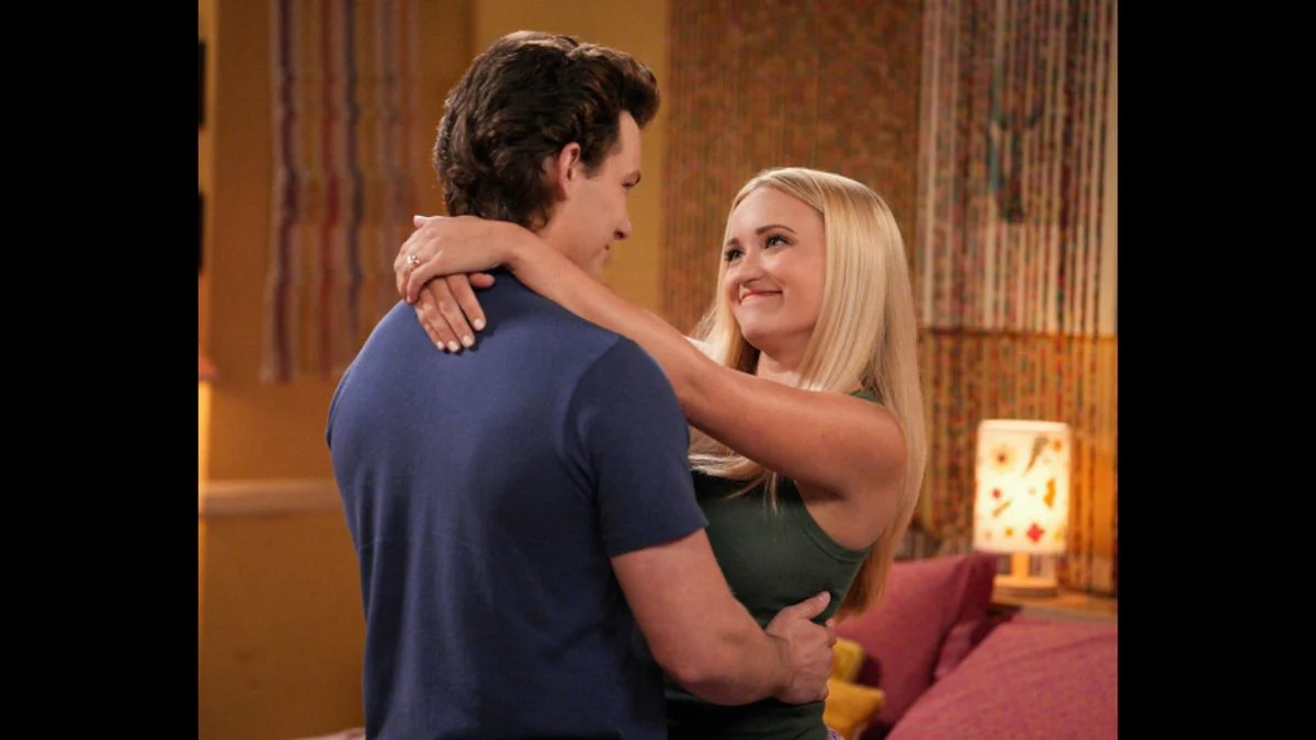 Emily Osment as Mandy McAllister looking up smiling at Montana Jordan as Georgie Cooper in a scene from Young Sheldon