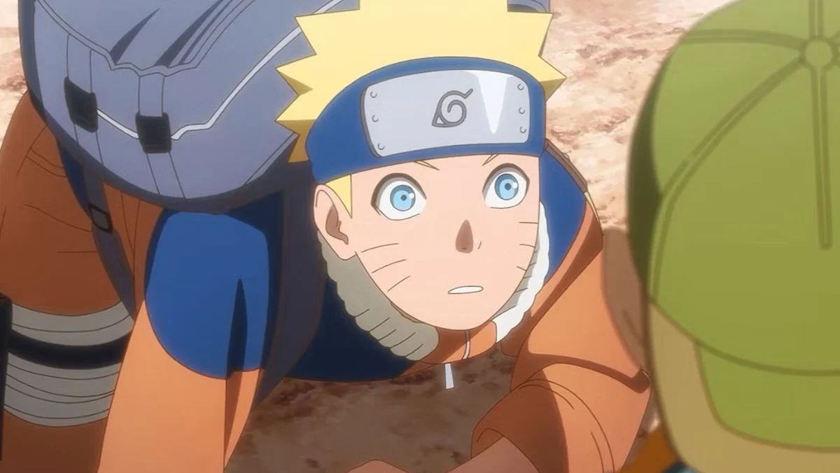 Naruto Uzumaki looking intently with blue eyes and his signature headband during the crossover announcement.