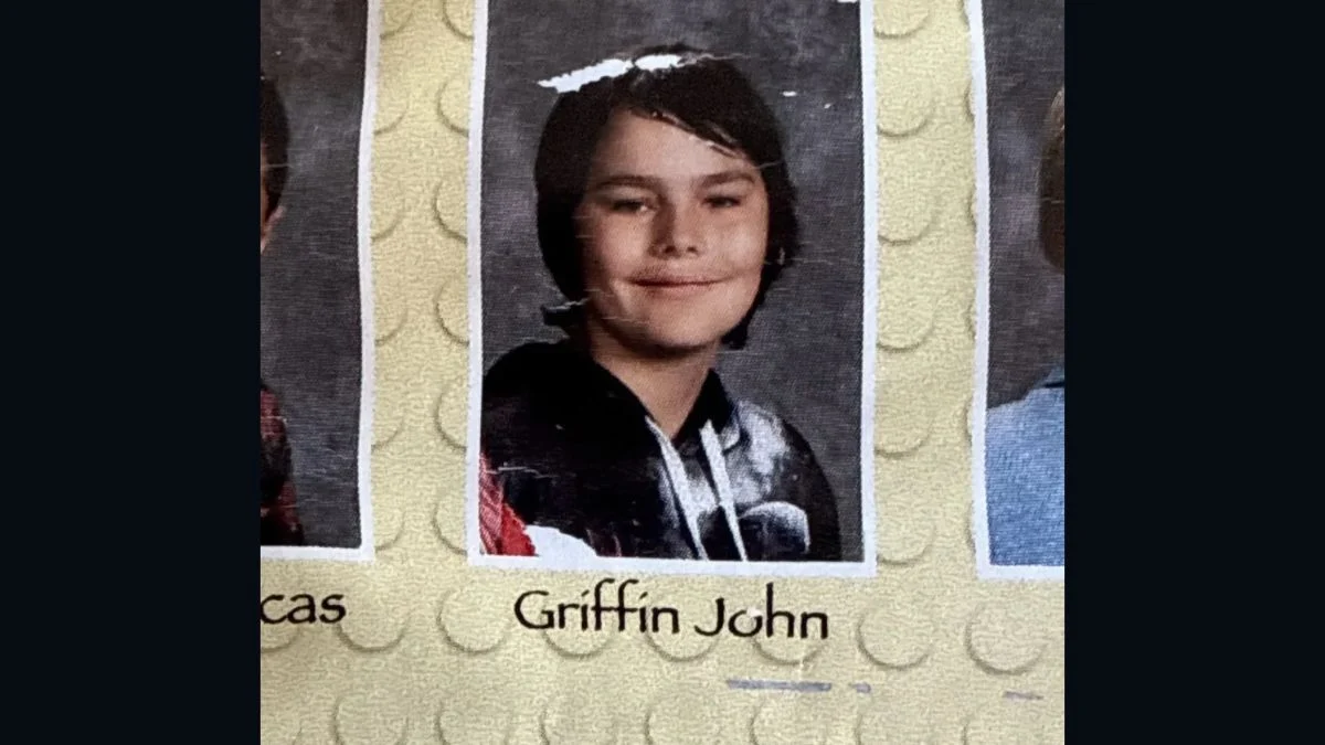 School yearbook photo showing Griffin John as a young student labeled with his name below the image.