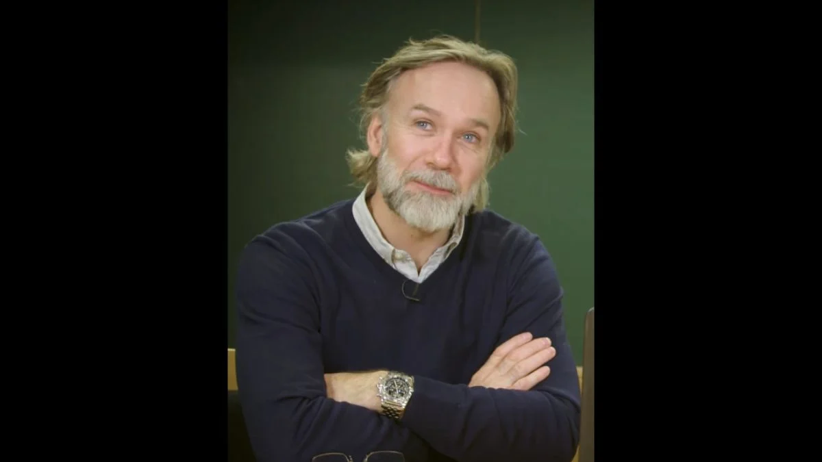 Chef Marcus Wareing posing with arms crossed during an interview