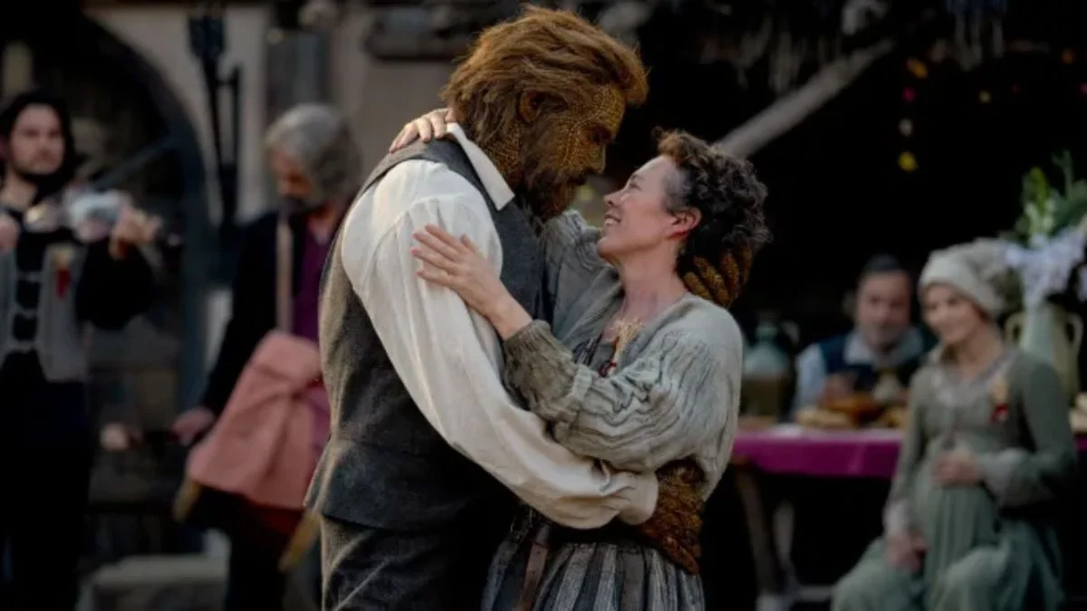 Olivia Colman dancing and embracing Alexander Skarsgård as the Wicker Husband in a scene from the film Wicker