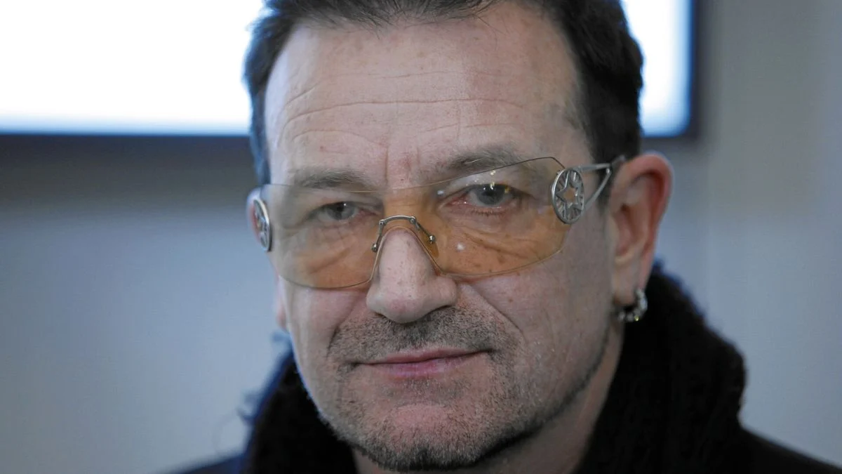 Bono of U2 wearing tinted glasses at a public event