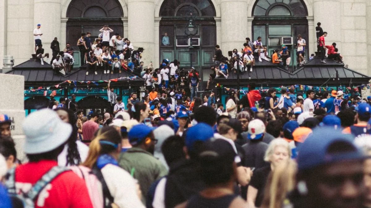 A large, dense crowd of music fans gathered together outdoors at a festival event